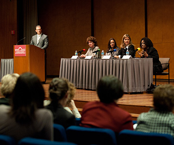 View of women seated on stage for event at Women Leading 2011