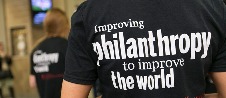 improving philanthropy to improve the world on back of t-shirt